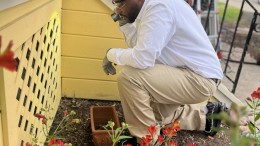 Expert professional in pest control inspecting crawl space in customer's home